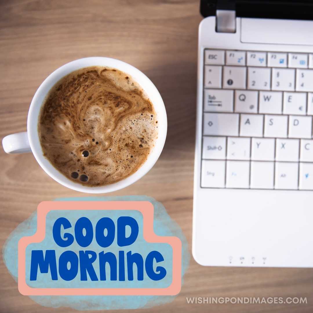 A cup of coffee sitting next to the laptop on the table. Good Morning Coffee Images